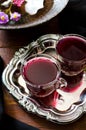 Fresh red grape juice and flowers Royalty Free Stock Photo