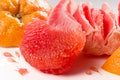 Fresh red grapefruit pulp and peel on white background close up Royalty Free Stock Photo