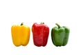 Fresh red, green and yellow bell peppers capsicum isolated on white background. Royalty Free Stock Photo