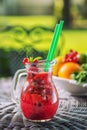 Fresh red lemonade with mint leaf in glass , strawberry, red currant, apple or beetroot fruit drink, product photography for healt