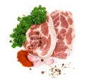 Fresh red meat with spices and parsley close-up on a white background.