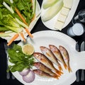 Red mullet fishes with green salad, feta cheese, melon and Turkish alcohol raki Royalty Free Stock Photo