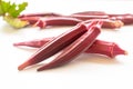 Fresh red okra with leave isolated on white background.