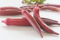 Fresh red okra with leave isolated on white background. Royalty Free Stock Photo