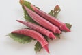 Fresh red okra with leave isolated on white background. Royalty Free Stock Photo