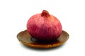 Fresh red onion on wood plate isolated Royalty Free Stock Photo