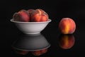 Fresh red peach isolated on black glass Royalty Free Stock Photo