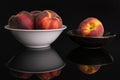 Fresh red peach isolated on black glass Royalty Free Stock Photo