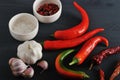 Fresh red peppers and of dried pods of chili peppers, garlic, sa Royalty Free Stock Photo