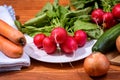 Fresh red radishes on wooden table Royalty Free Stock Photo