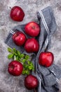 Fresh red ripe apples on gray background