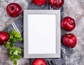 Fresh red ripe apples on gray background