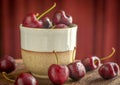 Fresh red cherries in brown ceramic cup, close up. Royalty Free Stock Photo