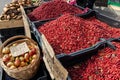 Fresh red ripe lingonberries in plastic boxes on a farmer's market retail display. Close-up