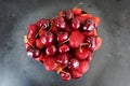 Fresh red ripe strawberries and cherries heart shaped on blackboard Royalty Free Stock Photo