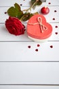 Fresh red rose flower on the white wooden table Royalty Free Stock Photo