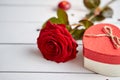 Fresh red rose flower on the white wooden table Royalty Free Stock Photo