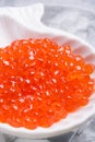 Fresh red salmon caviar. served around ice. macro shot. Protein luxury delicacy healthy food