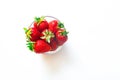 Fresh red strawberries in transparent bowl isolated on white background Royalty Free Stock Photo