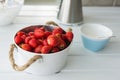 Fresh red strawberries in white bowl and sugarbowl Royalty Free Stock Photo