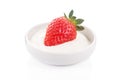 Fresh red strawberry in bowl with tasty sour cream