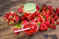 Fresh red strawberry and jam on wood background Royalty Free Stock Photo