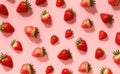 Fresh red strawberry on pink background, top view. Minimalistic scattered berries pattern