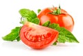 Fresh red tomato with cut and green leaves Royalty Free Stock Photo
