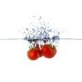 Fresh Red Tomato Fruits Sinking in Water Royalty Free Stock Photo