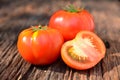 Fresh red tomato on old brown wood table at the morning Royalty Free Stock Photo