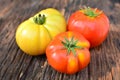 Fresh red tomato on old brown wood table at the morning Royalty Free Stock Photo