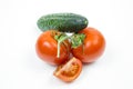 Fresh red tomatoes and cucumbers with water drops isolated on white background Royalty Free Stock Photo