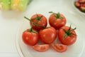 Fresh red tomatoes with drops of water on the tomato skin. Royalty Free Stock Photo