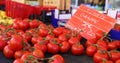 Fresh red tomatoes at a farmer market in France, Europe. Italian tomatoes. Street French market at Nice. Royalty Free Stock Photo