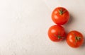 Fresh red tomatoes on gray texture background Royalty Free Stock Photo