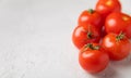Fresh red tomatoes on gray texture background Royalty Free Stock Photo