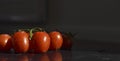 Ripe red tomatoes in water drops