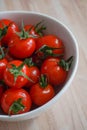 Fresh red tomatos in a white bowl Royalty Free Stock Photo