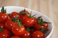 Fresh red tomatos in a white bowl Royalty Free Stock Photo