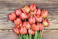 Fresh red tulips on a wood textured background Royalty Free Stock Photo