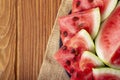 Fresh red watermelon pieces on a black plate on a wooden table. Sweet and juicy watermelon Royalty Free Stock Photo