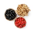 Fresh red, white and black currants in bowls isolated on white, top view Royalty Free Stock Photo