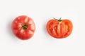 Fresh red whole tomato with water drops and sliced tomato isolated from above, concept of healthy food and nutrition, space for la Royalty Free Stock Photo