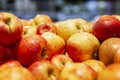 Fresh red-yellow apples on a counter in a supermarket. Healthy eating and vegetarianism. Close-up Royalty Free Stock Photo