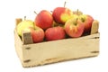 Fresh red and yellow apples in a wooden crate Royalty Free Stock Photo