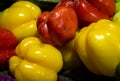 Fresh red and yellow bell peppers at vegetable store for sale at evening