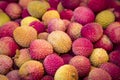 Fresh red and yellow litchi fruits on the market, also known as lichee, lychee, or lichi, Litchi chinensis natural food background