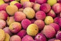 Fresh red and yellow litchi fruits on the market, also known as lichee, lychee, or lichi, Litchi chinensis natural food background