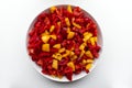 Fresh red and yellow sliced pepper on white background. View from above Royalty Free Stock Photo