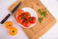 Fresh red and yellow tomatoes from above on a white plate Royalty Free Stock Photo